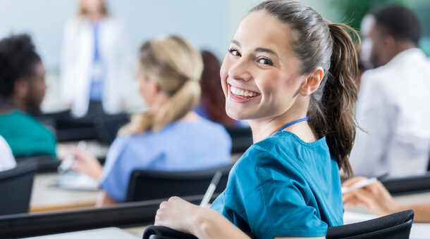 Cheerful female medical student in the classroom